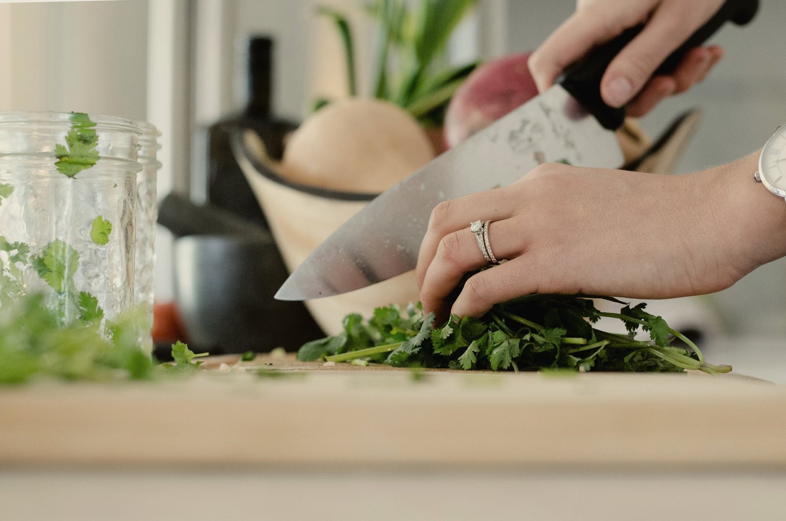 Chopping fresh herbs on a wooden board